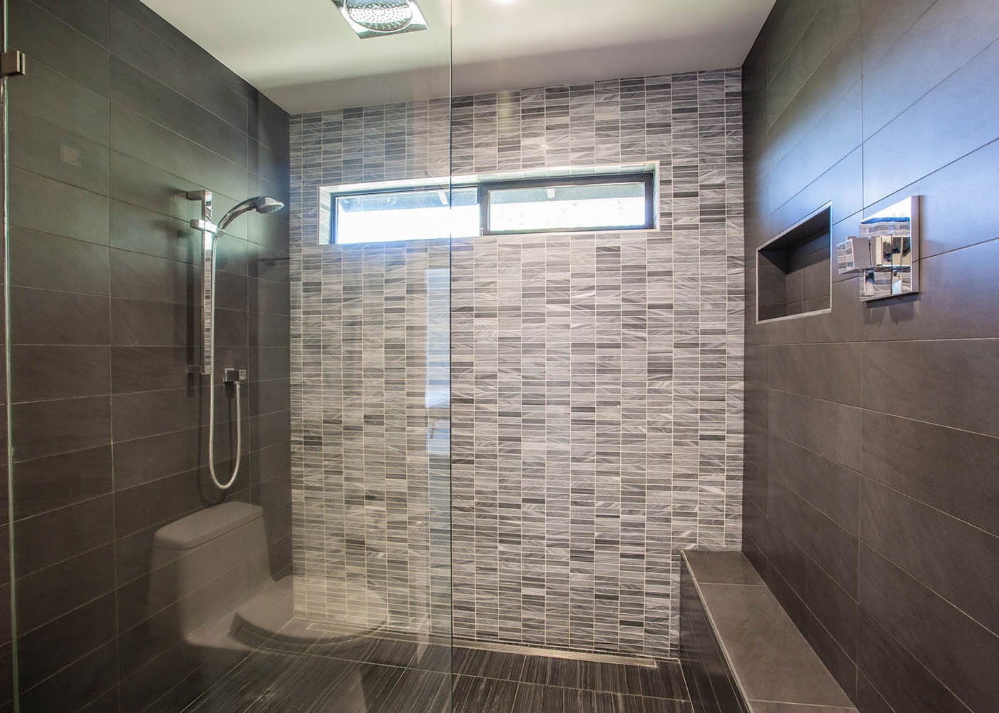 Freshly installed bathroom tile completes a professional walk-in shower installation in Bloomington, IL.